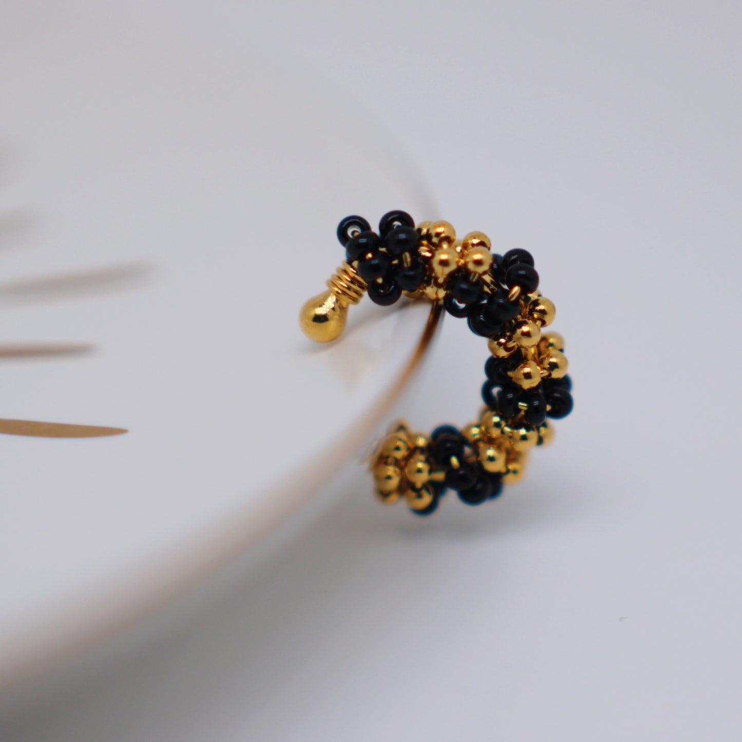 Pop black and gold earcuff